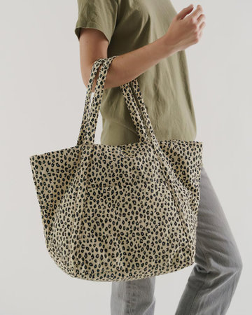 Woman holding a tote on a white background. Isolated.の写真素材