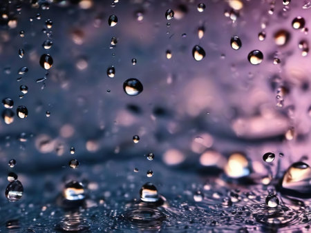 Water drops on a glass surface. Shallow depth of field.の素材