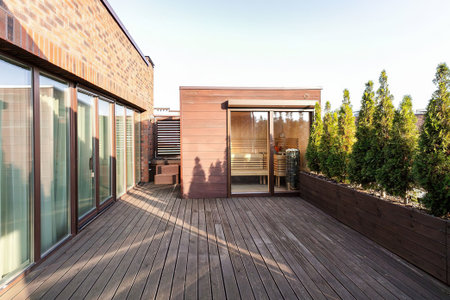 Modern house with wooden terrace and view to the garden. Nobody insideの写真素材