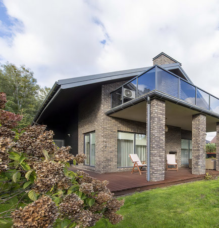 Exterior of modern house with terrace and garden. Northwest, USAの写真素材