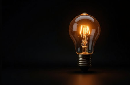 Technology light bulb in the darkの素材