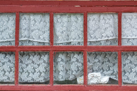 Old window in the house.Large window with wooden frames in the village house.Old rural architecture.
