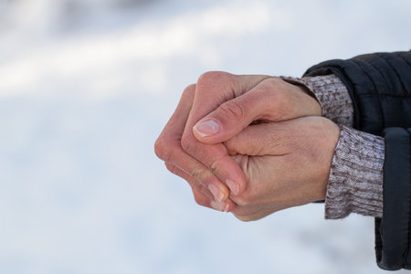 Women's hands in winter. Warmth and hand warming on cold winter days.の写真素材