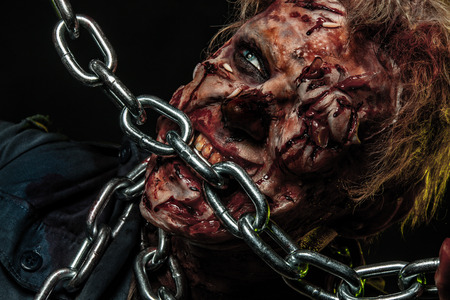 Close-up portrait of a horrible scary zombie man. Horror. Halloween 2018の写真素材
