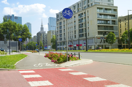 Picturesque city street with skyscrapers and bicycle lane; light sunny effectの写真素材