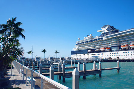 Key West, United States - February 6, 2016: People walk at the sunny Key West pier near cruise ship and Atlantic Ocean.のeditorial素材