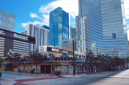 Miami, United States - February 8, 2016: People and cars move down the street near in the Miami Downtown.のeditorial素材
