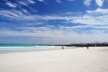 Miami Beach, United States - February 11, 2016: People walk and relax at the sunny South Beach of Miami near South Point Pier.のeditorial素材