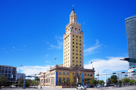 Miami, United States - February 12, 2016: People and cars move alongside the Freedom Tower, touristic attraction building, in the Miami Downtown.のeditorial素材