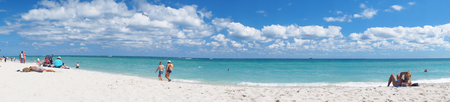 Miami Beach, United States - February 12, 2016: People walk and relax at the sunny South Beach of Miami near Atlantic Ocean.のeditorial素材