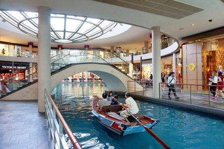 People walk at the Marina Bay Sands Shoppesのeditorial素材