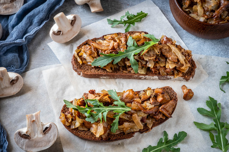 Hot sandwiches with mushrooms, top view, gray wooden backgroundの写真素材