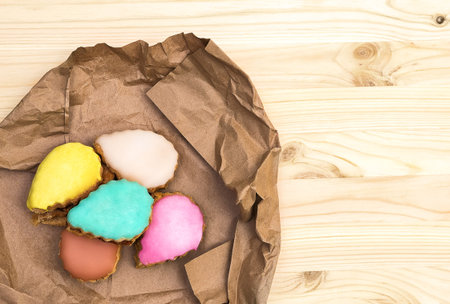 Multi-colored cake served on a wooden plank background, top view, flat lay, copyspase on the right, horizontalの写真素材