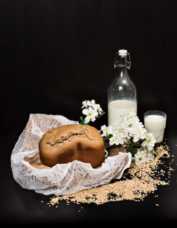 Bread composition, milk bottle, milk glass, scattered grains, bread production, vertical, side view, top copy spaceの写真素材