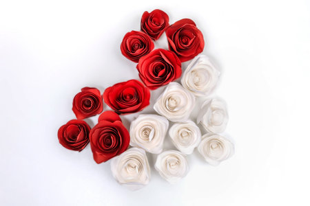 Heart made of paper red and white roses, top view diagonally, isolate on a white backgroundの写真素材