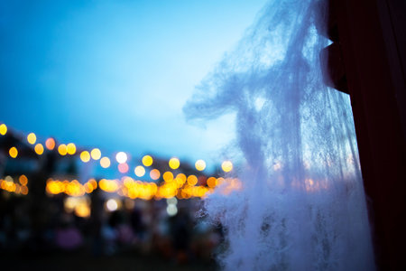 A beautiful and mysterious image of a city at night. The soft light and blurred colors give the scene an air of wonder and enchantment.の写真素材
