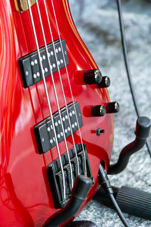 This vibrant red electric bass guitar is highlighted with its sleek body and intricate pickups....