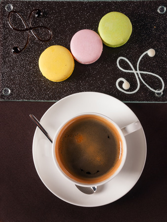 Beautifully decorated dessert with a cup of coffeeの写真素材