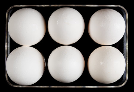 Tray for eggs on a black background