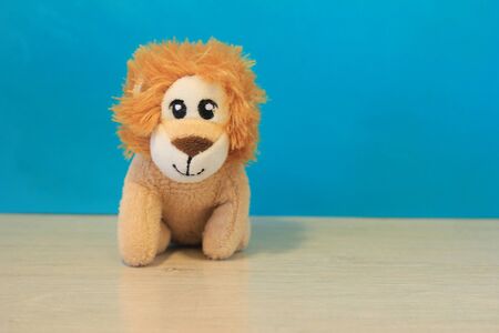 a small toy tiger sitting on a table aloneの写真素材