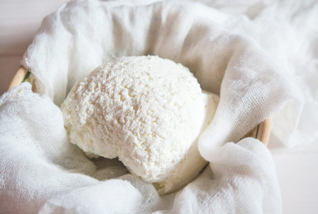 The cottage cheese on the table.