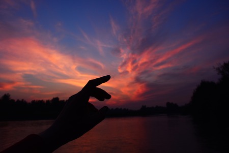 Magic sunset with colourful cloud and moonの写真素材