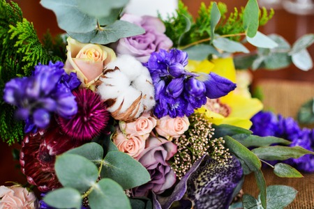 Close up of wedding bouquet eucalyptus cotton and other violet pink green flowers.の写真素材