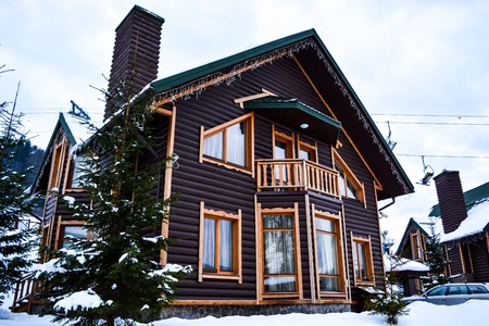 BUKOVEL, UKRAINE - December 17, 2016: Wooden house in mountains in ski resort Bukovel, Ukraine. Bukovel is a most popular ski resort in Ukraine, in 2012 was named the fastest-growing world ski resort.のeditorial素材