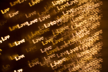 Blurring lights bokeh background of words LOVE