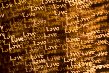 Blurring lights bokeh background of words LOVEの写真素材