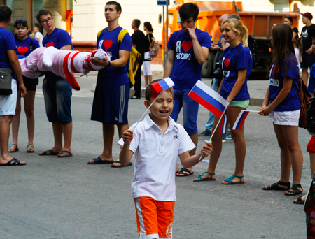VOLGOGRAD, RUSSIA - JUNE 12, 2015: Boy with flags in celebration of independence Day of Russia in Volgogradのeditorial素材