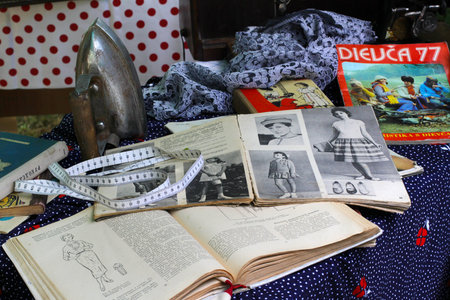 VOLGOGRAD, RUSSIA - SEPTEMBER 08, 2012: Vintage iron, textiles, old magazines and books at the retro...
