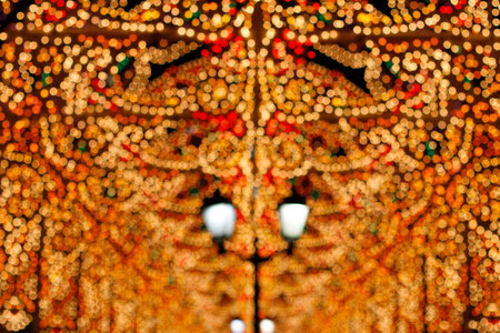 Christmas garland light installation in the city. Soft focus background. Blurring lights bokeh...