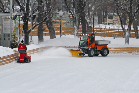 Moscow, Russia - January 03, 2013: Special machine and worker clean the ice skating rink in Park Gorkogo in Moscowのeditorial素材