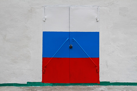Russian flag on door closed on the lockの写真素材