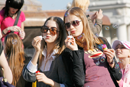 Volgograd, Russia - April 01, 2009: Portrait of young women blowing soap bubbles on a flashmob in Volgogradのeditorial素材