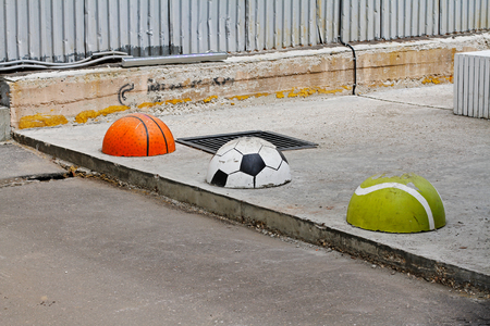 Protective hemispheres in the form of basketball, football and tennis ballsの写真素材