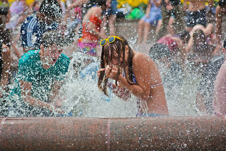 Volgograd, Russia - July 01, 2012: Young woman taking part in Water Wars flashmob in Volgogradのeditorial素材
