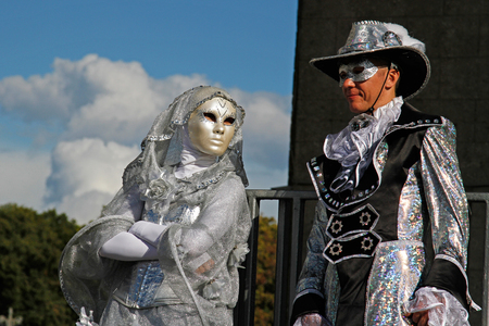 Moscow, Russia - August 01, 2015: Portrait of a street actor in a carnival mask and on stilts at the festivalのeditorial素材