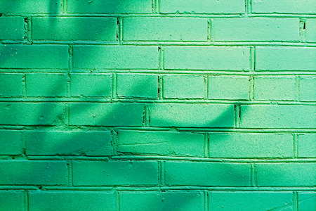 Green brick wall as background or textureの写真素材