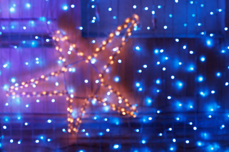 Blurring lights bokeh background of LED decoration in the form of star and garland Ñurtains