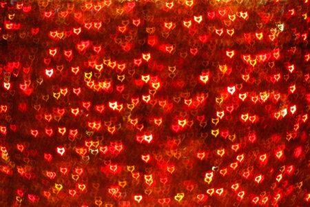 Blurring lights bokeh background of red Devil hearts