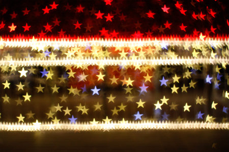 Blurring lights bokeh background of red and golden stars