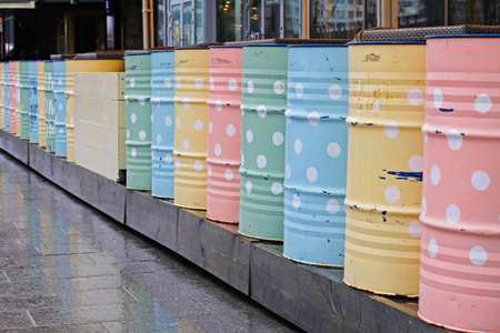 Colorful metal barrels for decoration standing outdoors