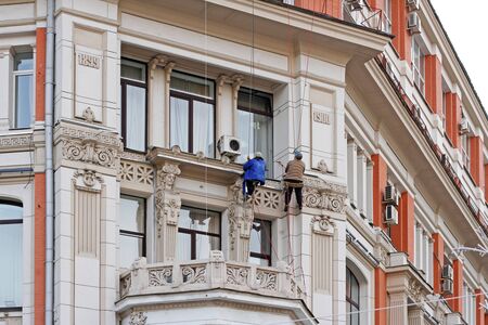 Moscow, Russia - March 13, 2017: Ð¡onstruction workers reconstructing the facade of Federal Agency of Sea and River transport (the former tenement house of Khomyakov) on Kuznetsky bridge in Moscowのeditorial素材