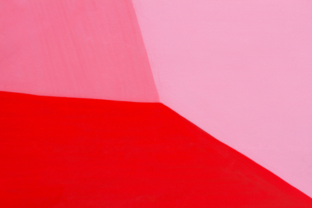 Colorful (red and pink) painted wall with cracks as background or textureの写真素材