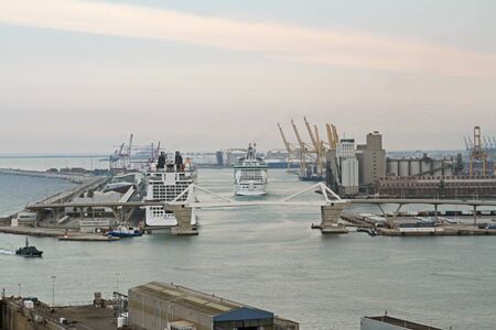 Barcelona, Spain - September 14, 2014: Aerial view of the port of Barcelona with big cruises, modern bridge and Mediterranean Seaのeditorial素材
