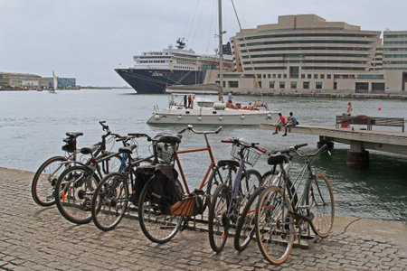 Barcelona, Spain - September 14, 2014: City bicycles stand in a row on a parking on the waterfront at the old port of Barcelonaのeditorial素材