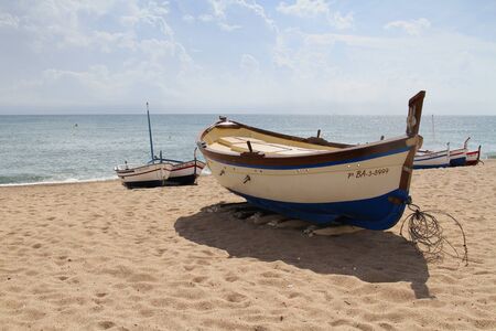 Calella, Spain - September 17, 2014: Fishing boats Mediterranean beach in Calellaのeditorial素材