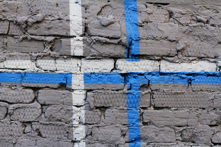 Colorful (grey, blue and white) painted wall with cracks as background or textureの写真素材